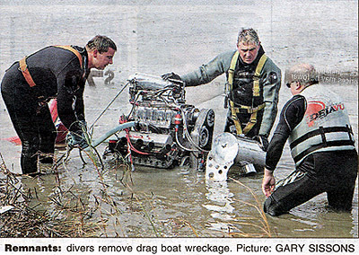 Remnants: drivers remove drag boat wreckage. Picture: GARY SISSONS