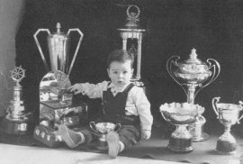 Lee Kavanagh pictured with his fathers trophies (won while racing 'Skipper') 